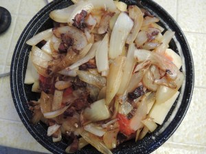 Assemble pot roast in the solar oven pan, meat first, then carrots and potatoes, then onion mixture, and top with tomatoes.