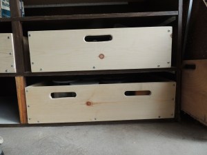 The box drawers have cut out handles in front and back so i can pull a given box out to get to what is stored inside.