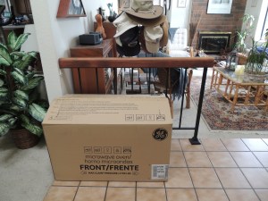 We have a new stainless microwave-hood combo, but were told to not install it until after the cabinet work is done. So here it will sit until the cabinet work is finished.