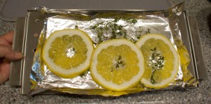 I coated the filets with olive oil and salt, and laid them on a bed of fresh thyme and Meyer lemon slices. The lemon and thyme were from our garden.